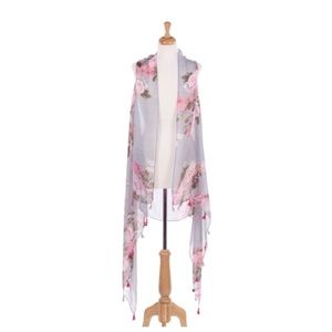 Sleeveless vest with a large floral print.